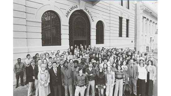 Arkansas Democrat employees pose in the mid-1970s.  The man on the far right is publisher Walter Hussman Jr. © Photograph courtesy of Jerry McConnell