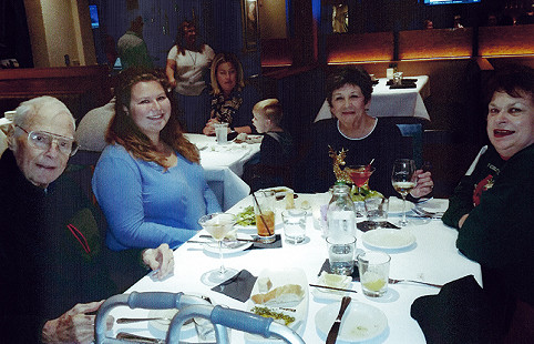 Monsignor John O'Donnell with his niece (2nd from left) and friends © Pryor Center for Arkansas Oral and Visual History, University of Arkansas