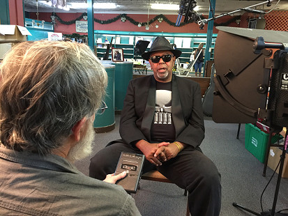 Don Wilcock interviews Zac Harmon at Bubba's Blues Corner during the King Biscuit Blues Festival; Helena, Arkansas, 2015 © Pryor Center for Arkansas Oral and Visual History, University of Arkansas