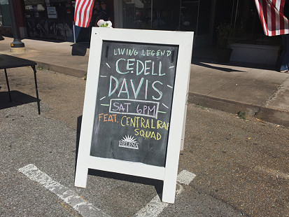 Signboard on Cherry Street advertising an upcoming performance by Cedell Davis during the King Biscuit Blues Festival; Helena, Arkansas, 2015 © Pryor Center for Arkansas Oral and Visual History, University of Arkansas