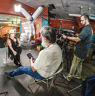 Christina Vierra of Mississippi Bigfoot being interviewed by Don Wilcock during the King Biscuit Blues Festival; Josh Colvert on camera; 2016 © Eric Gorder 2017; egorder@gmail.com