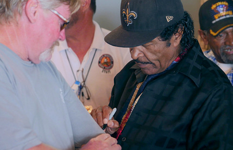 Bobby Rush signs autographs at the Bobby Rush Appreciation Day event, which was held at Southbound Pizza during the King Biscuit Blues Festival; Helena, Arkansas, 2016 © Pryor Center for Arkansas Oral and Visual History, University of Arkansas