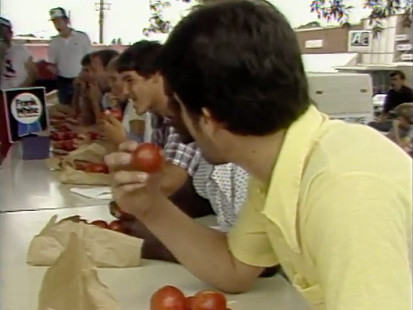 Still from KATV digitized recording of a tomato-eating contest at the Bradley County Pink Tomato Festival; Warren, Arkansas, 1982 © Pryor Center for Arkansas Oral and Visual History, University of Arkansas