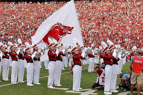 Razorback Band playing "Arkansas Fight" as ESPN films a cheerleader carrying the Hog flag and leading Razorbacks through the Big A © Photo courtesy of Joe Swink