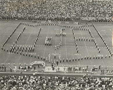 The combined Arkansas and TCU bands perform National Anthem together at Arkansas home game, date unknown © Photo courtesy of Special Collections, University of Arkansas Libraries, Fayetteville